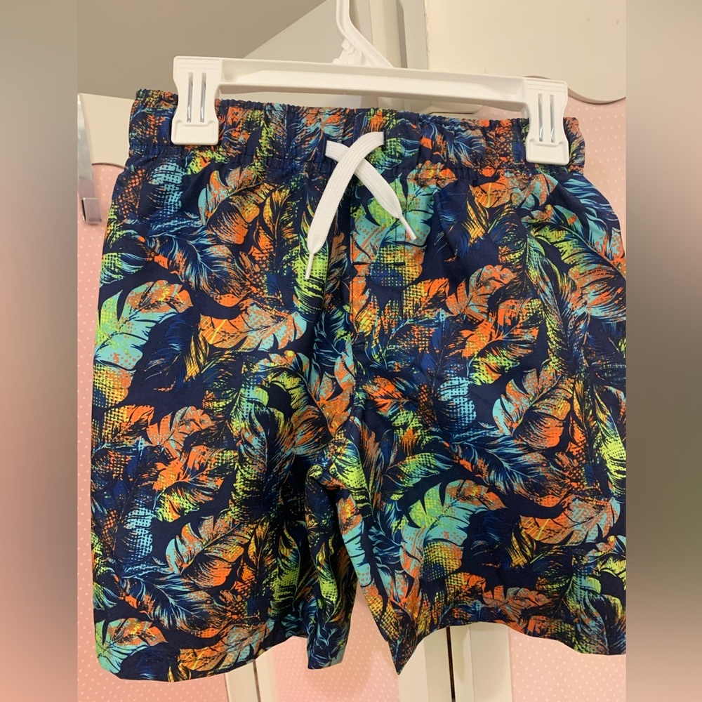 Boys swim trunks shorts size 8. Palm tree graphic design. Drawstring lining